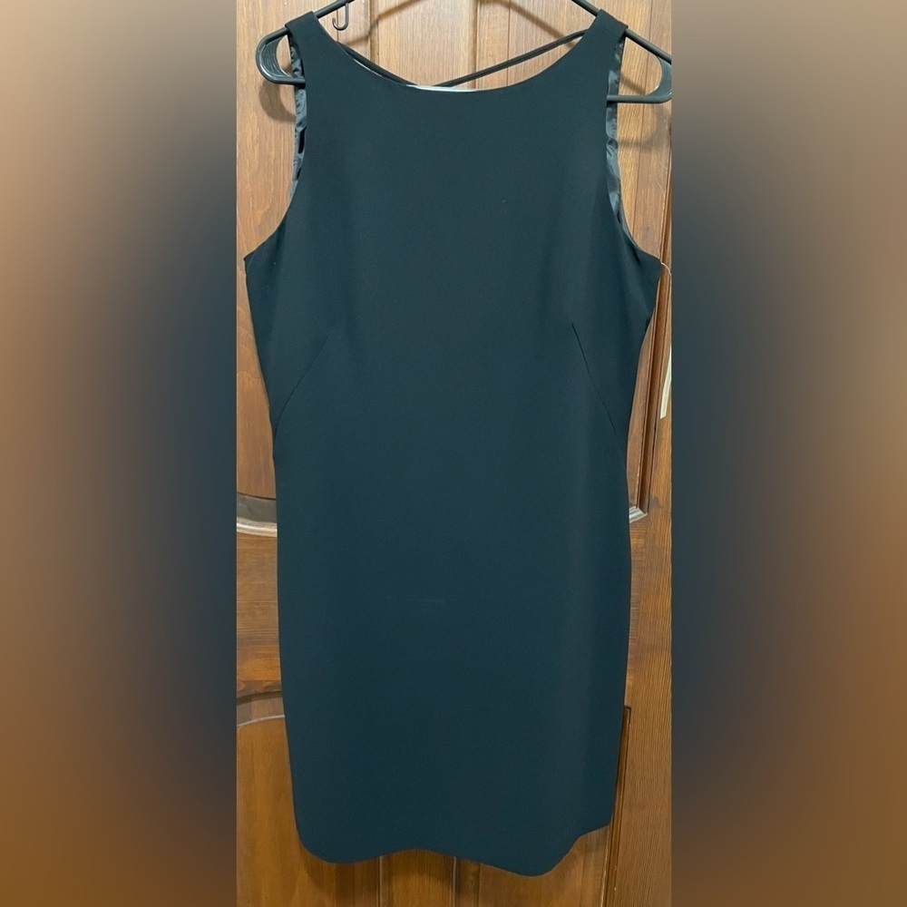 Amanda Smith black sleeveless size 12 dress with Crisscross black straps.